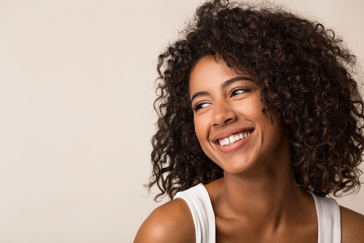Smiling woman after facial treatment